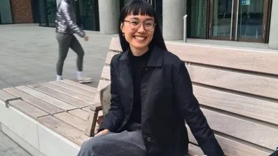 Woman smiling on a bench