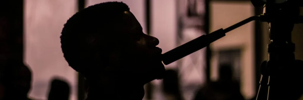 Silhouette of a man singing