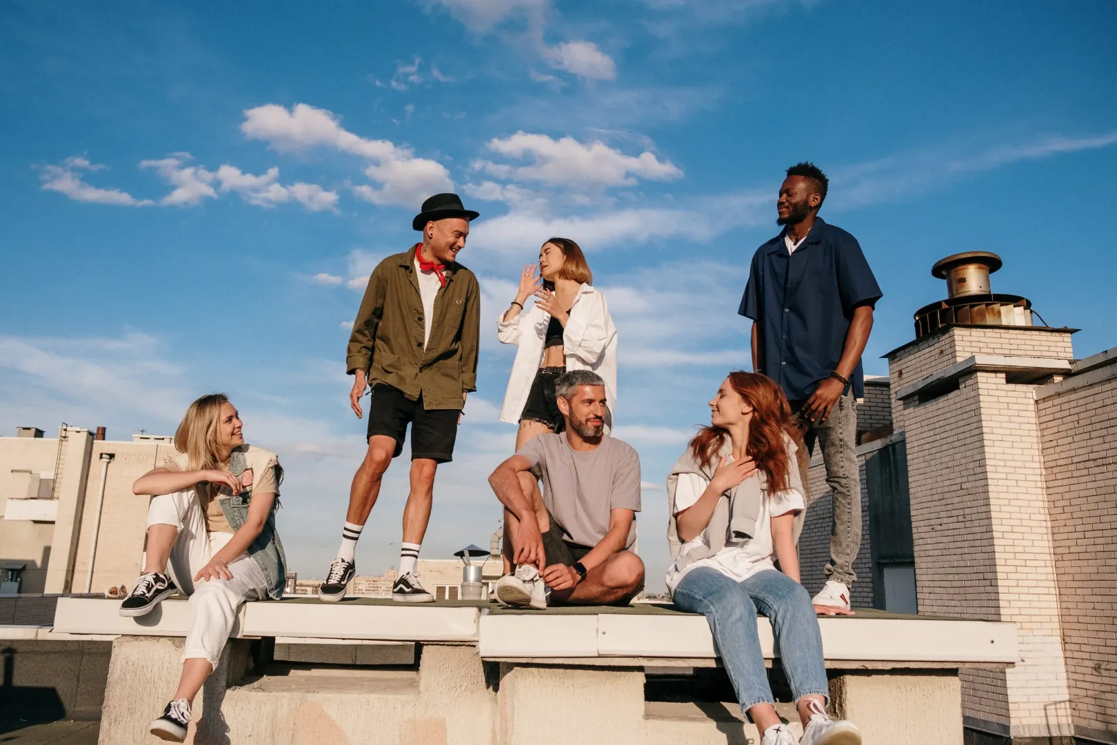 Six young people chatting on a sunny rooftop, header image for Crowd DNA case studies