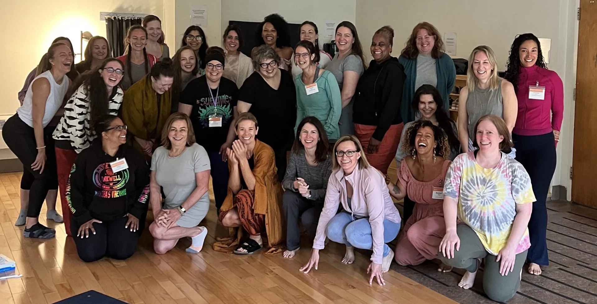 Group of smiling women posing together at a Women Without Kids retreat