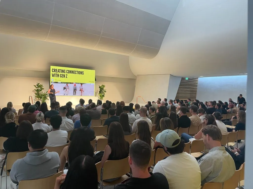 Speaker presenting Australia's Gen Z are getting real findings to an audience at a Snapchat event