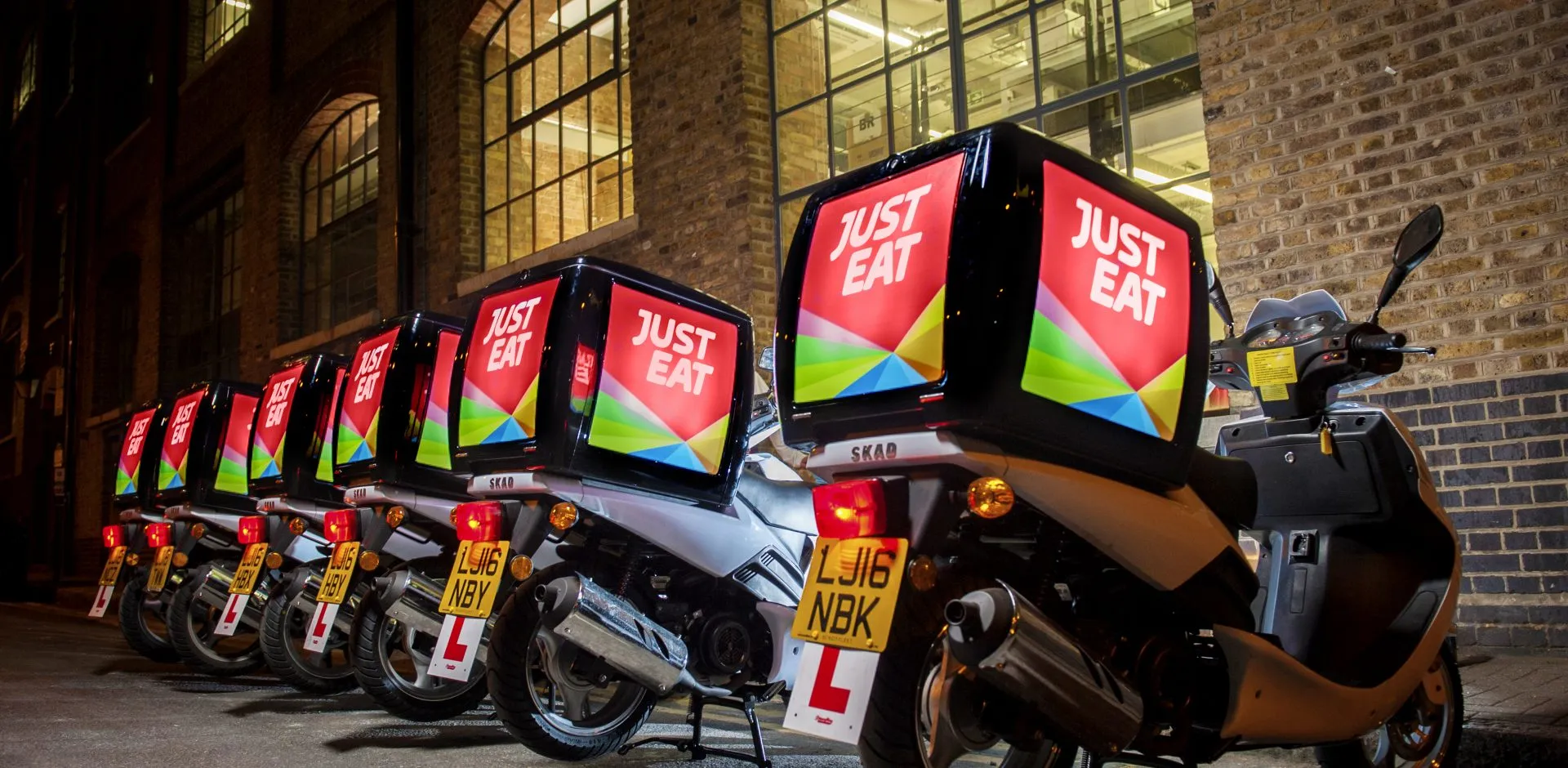 Just Eat delivery scooters parked in a row, from Crowd DNA research with takeaway owners